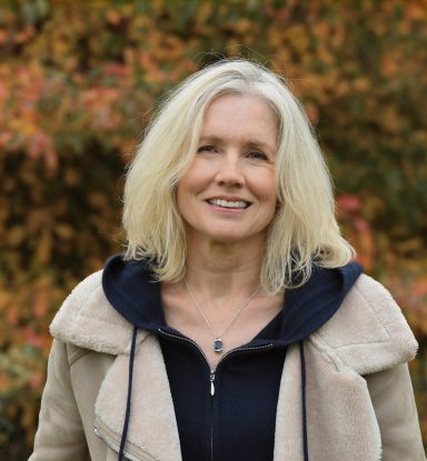 Natural portrait of mature female model outdoors in autumn setting