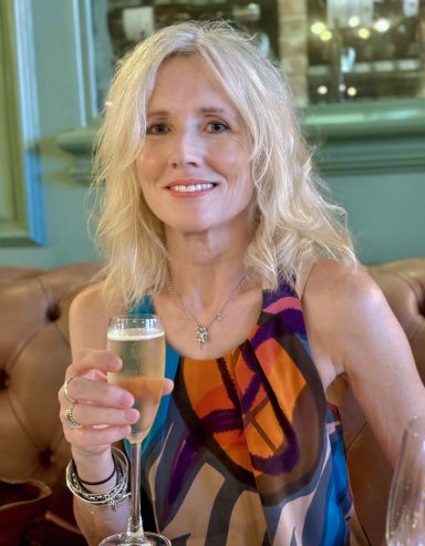 Mature female model enjoying a drink in a relaxed cafe lifestyle portrait