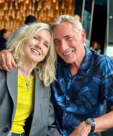 Happy mature couple models posing together in relaxed lifestyle environment